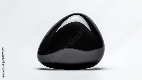 a black stone on a white surface