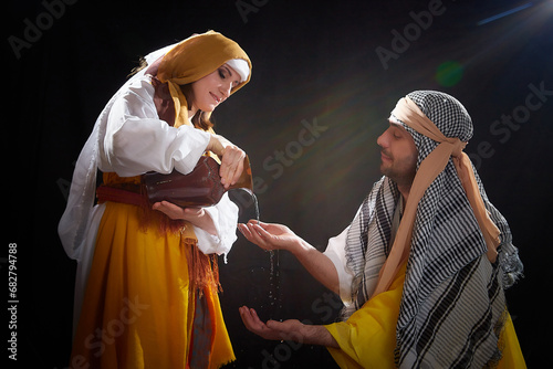 A couple in love or a married couple in stylized Eastern clothing from Israel, Palestine, Iran, Pakistan together. A tender photo session in the style of the Middle East and the Bible photo