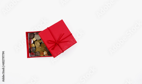 A coins in the gift box. Isolated with white background.