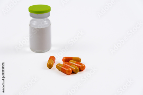 A vial and medicine. Isolated with white background.