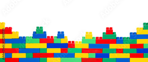 Kid's Wonderland: Constructing a World of Fun and Development. Banner. Wall from Colorful plastic brick blocks. Education, children's creativity