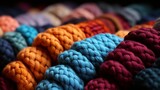 Vibrant hues dance in intricate patterns, woven with delicate threads and cozy fibers, capturing the essence of creativity and warmth within the indoor oasis of yarn, crochet, and knitting