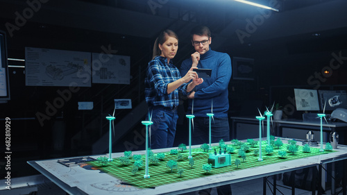 Renewable Energy Engineers Design 3D Wind Turbine Park Using Augmented Reality Software and Smartphone. Specialists Use Virtual Reality App to Work on Green Energy Environmental Power Production