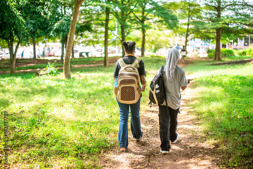 Oyo, NIGERIA - Novemebr 09, 2023: Students walk across a  park in the University photo