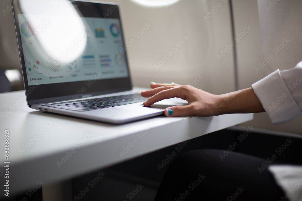 Woman working and looking at graphs Woman working and looking at graphs