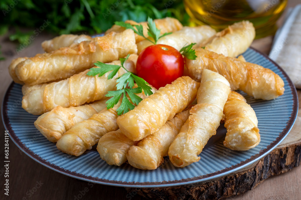 Fried pastry wrapped in cheese in phyllo. Pie in the form of a roll. Turkish name; Kalem borek - sigara boregi