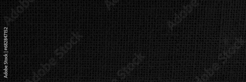 Jute hessian sackcloth canvas woven texture pattern background in light black color blank empty.