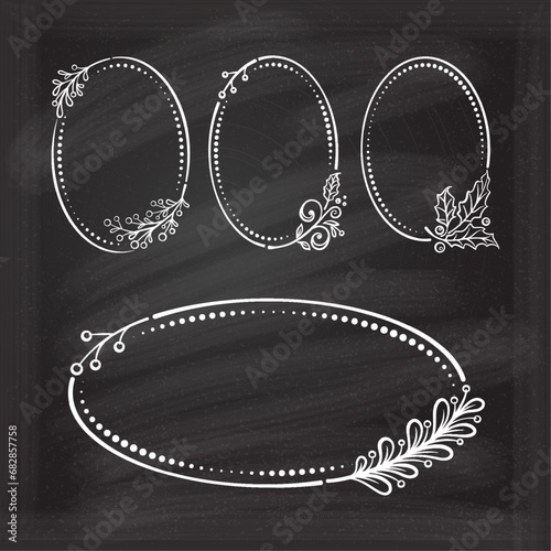 Vintage style oval frames set with a Christmas floral decoration on a chalkboard background