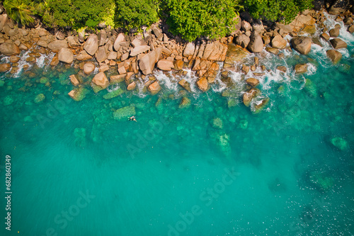  Bird eye drone of turquoise transparent water, corals and rocks, Mahe Seychelles 2 photo