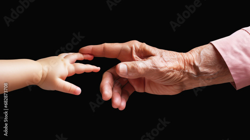 Old hand holding young hand. Grandparent and grandchildren concept.