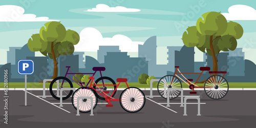 Vector illustration of bicycle parking area. Cartoon scene with beautiful cityscape with blue sky, silhouettes of modern houses, trees, bushes, road signs, bicycle parking. Vehicle parking.