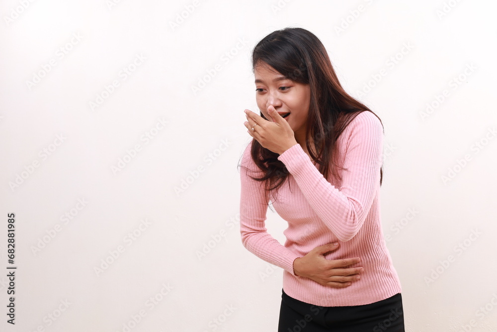 Young asian girl standing while laughing and covering her mouth. Isolated on white Young asian girl standing while laughing and covering her mouth. Isolated on white