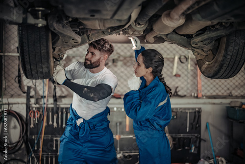 Auto mechanics diagnose suspension issues using precise tools, ensuring safe vehicle performance.