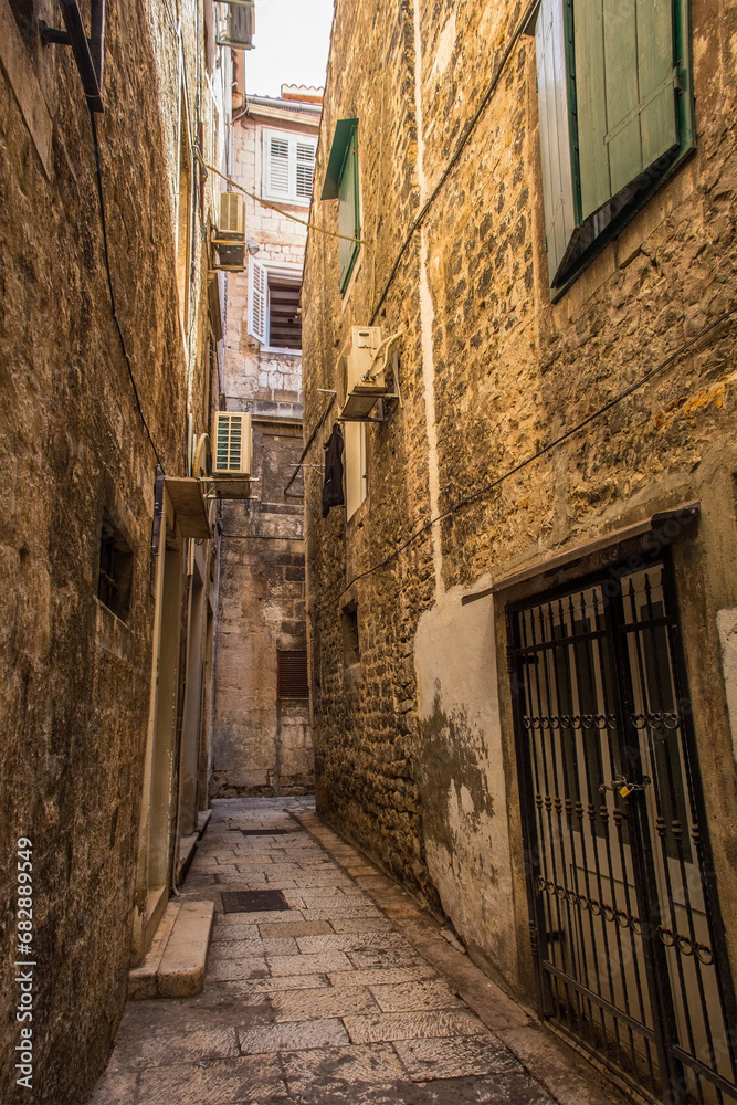 Fototapeta premium Historic residential buildings in a quiet back street in the city of Split in Croatia