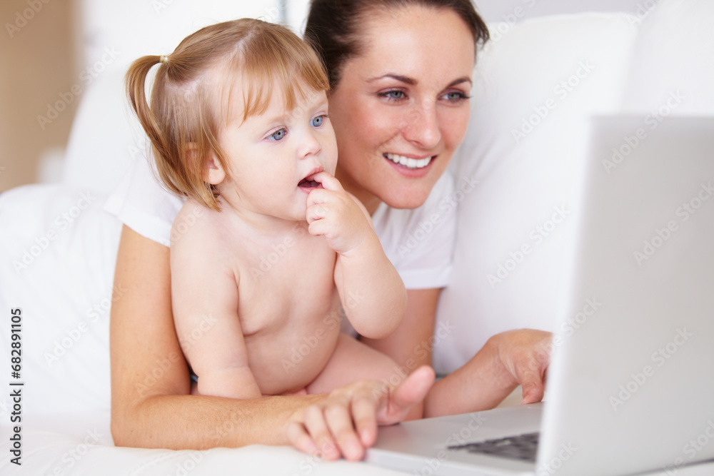 Family, laptop for remote work with a mother and baby in the bedroom of a home together to multitask. Computer, freelance or childcare with a woman parent and her girl toddler on an apartment bed Family, laptop for remote work with a mother and baby in the bedroom of a home together to multitask. Computer, freelance or childcare with a woman parent and her girl toddler on an apartment bed