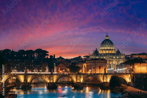 Rome, Italy. Papal Basilica Of St. Peter In The Vatican And Aelian Bridge In Evening Night Illuminations.