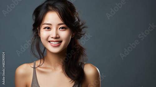 Asian Chinese woman smiling. Smooth healthy face skin. Skincare commercial portrait