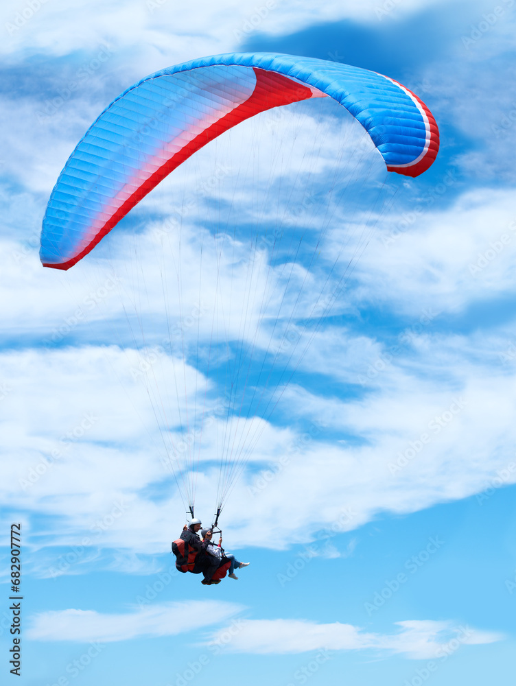 Man, parachute or paragliding in blue sky for adventure, flight freedom or courage with extreme sport. Pilot, nature and fearless in outdoor fitness for health, sports and wellness with glide in air Man, parachute or paragliding in blue sky for adventure, flight freedom or courage with extreme sport. Pilot, nature and fearless in outdoor fitness for health, sports and wellness with glide in air