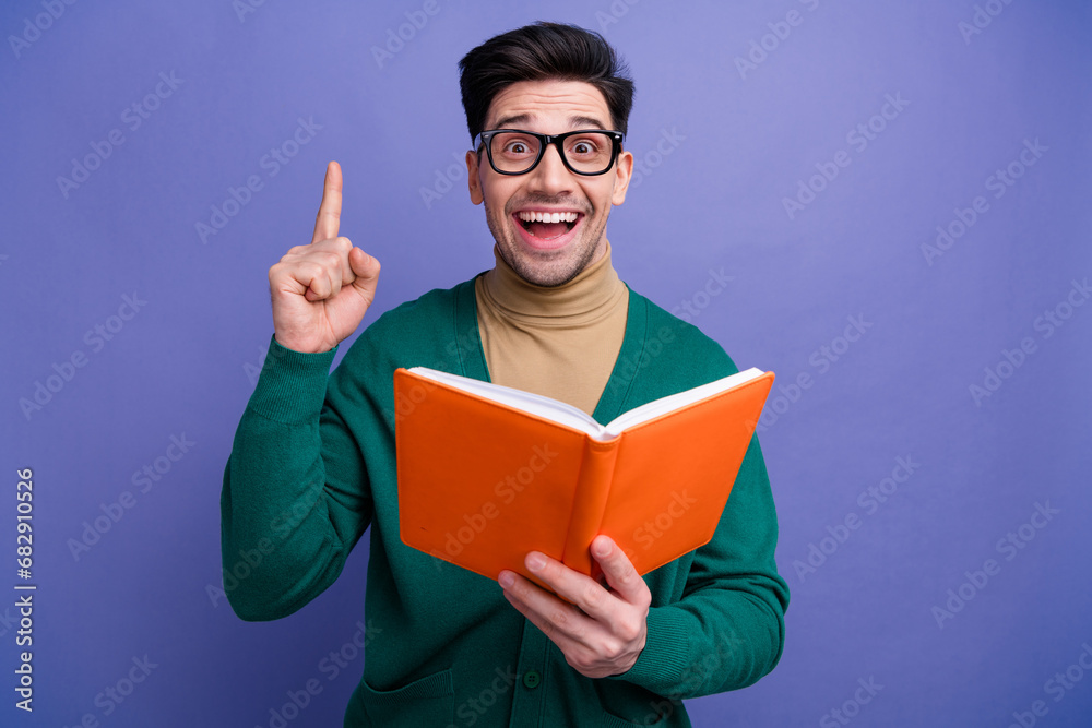 Photo of excited cheerful smart man wear stylish green clothes brilliant great opinion solution isolated on purple color background Photo of excited cheerful smart man wear stylish green clothes brilliant great opinion solution isolated on purple color background