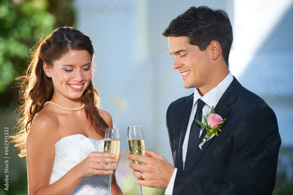 Happy couple, wedding and champagne glasses in celebration for marriage, love or commitment at outdoor ceremony. Married man and woman smile with alcohol for toast, date or cheers on honeymoon Happy couple, wedding and champagne glasses in celebration for marriage, love or commitment at outdoor ceremony. Married man and woman smile with alcohol for toast, date or cheers on honeymoon