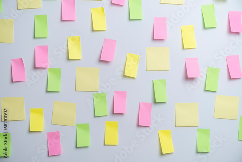 Empty sticky paper note on the wall ready to write wording