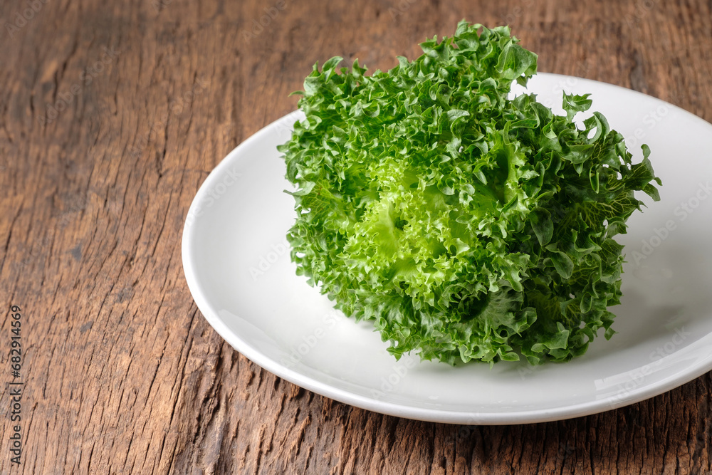 Frillice Iceberg Lettuce on white plate Frillice Iceberg Lettuce on white plate