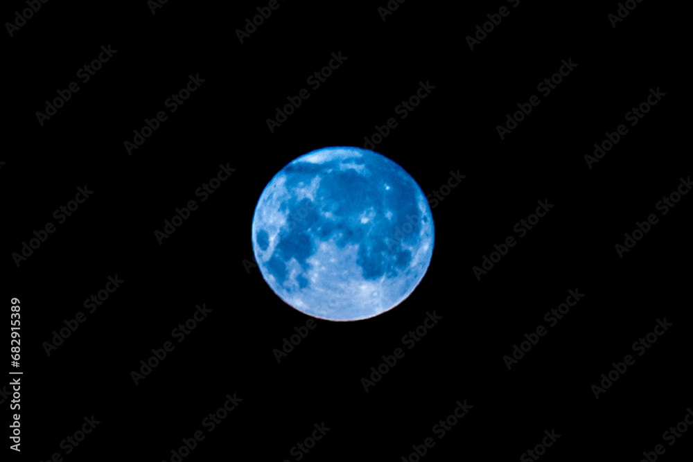 Blue moon nature light object in the night sky, close-up Blue moon nature light object in the night sky, close-up