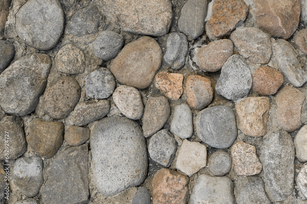 Stones cobblestones cement wall solid texture background rough street rock surface Stones cobblestones cement wall solid texture background rough street rock surface