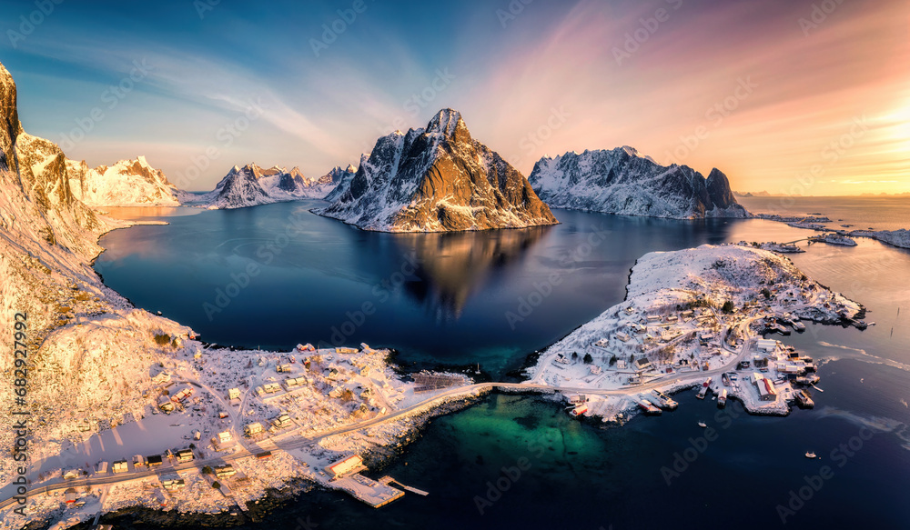 Colorful sunrise over Lofoten Islands and traditional norwegian fishing village in winter at Norway - obrazy, fototapety, plakaty 