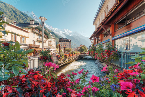 Chamonix Mont Blanc downtown among the French alps with flower blooming, canel and architechural classic building at Haute Savoie, France