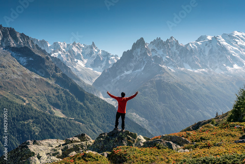 A male hiker standing with enjoying the Mont Blanc mountain range view during trail in Lac Blanc at France © Mumemories