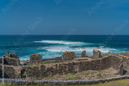 Atlantic ocean landscape with ruins of a synagogue at the north coast of Santo Antao Island