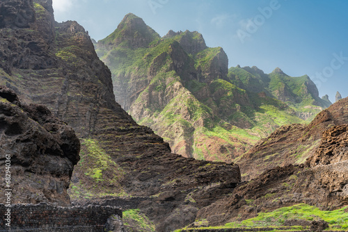 A view of the volcanic mountains surrounding with green grass on Santo Antao Island, Cape Verde