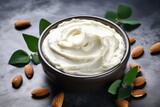 DIY Almond Cocoa Body Butter for Beauty and Care. Aromatherapy Cleanse in Bowl on Concrete Background