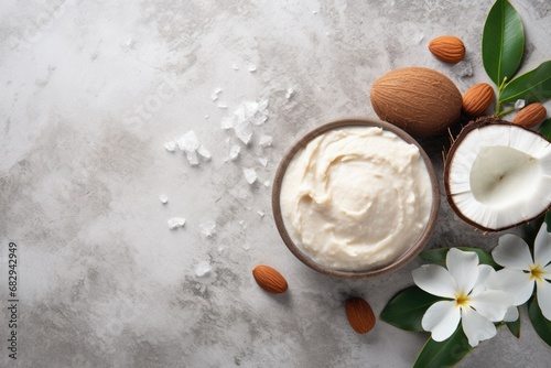 DIY Cocoa and Almond Body Butter for Nourishing Beauty Care on Concrete Background photo