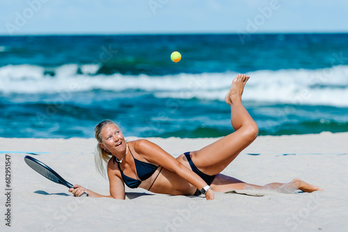 Professional woman playing beach tennis on a beach. Professional sport concept. Horizontal sport theme poster, greeting cards, headers, website and app