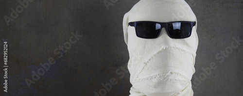 portrait of a mummy in white bandages photo