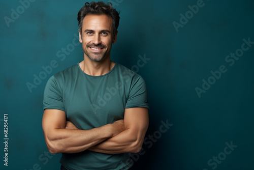 smiling man with crossed arms with copy space beautiful background