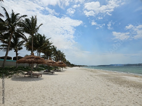 Bilene Mozambique beach with palm trees photo