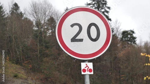 road sign speed limited to 20 in the rain close-up, speed limit sign 20 mph, speed limit sign photo