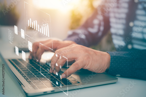 Analyst working with business analytics data management system on laptop computer make a report with metrics connected to database. Corporate strategy for operations, finance, sales, marketing.
