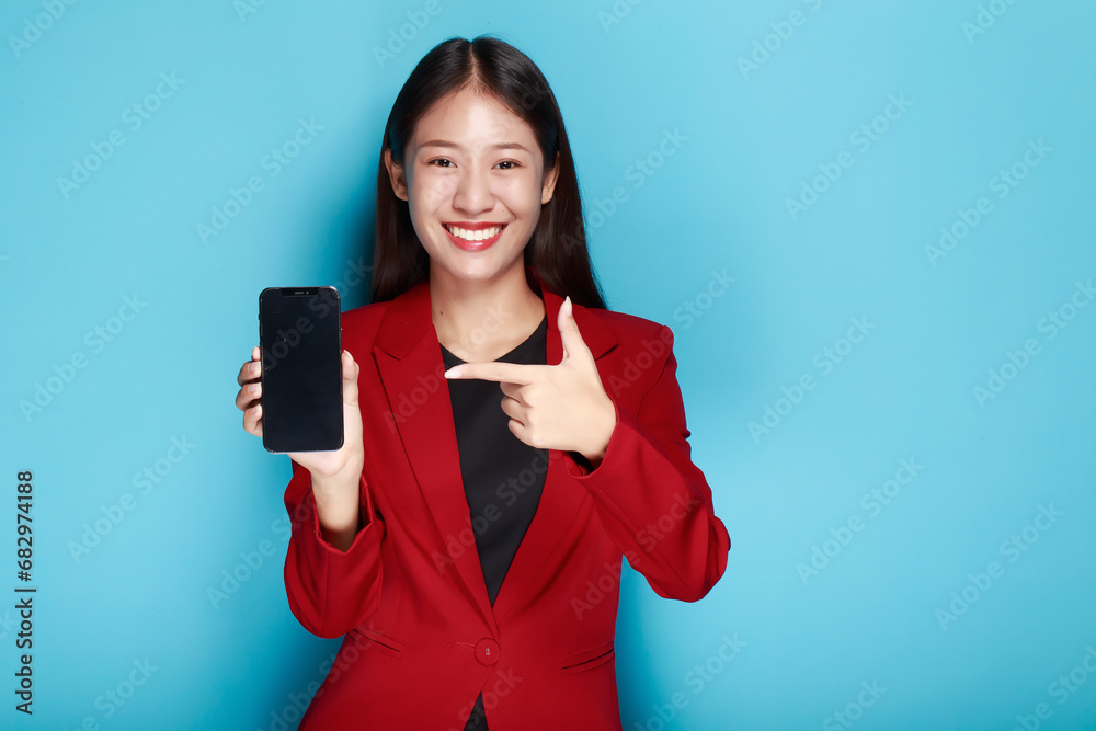 Woman showing point fingers isolated, Standing and pointing happily, Portrait of a beautiful young woman in a light blue background, Beautiful girl on the red background showing point fingers poses. Woman showing point fingers isolated, Standing and pointing happily, Portrait of a beautiful young woman in a light blue background, Beautiful girl on the red background showing point fingers poses.
