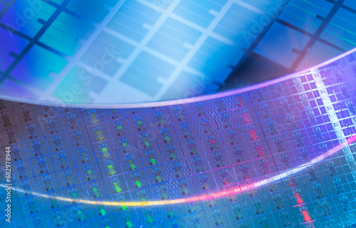 blue Silicon Wafer with microchips used in electronics for the fabrication of integrated circuits.
