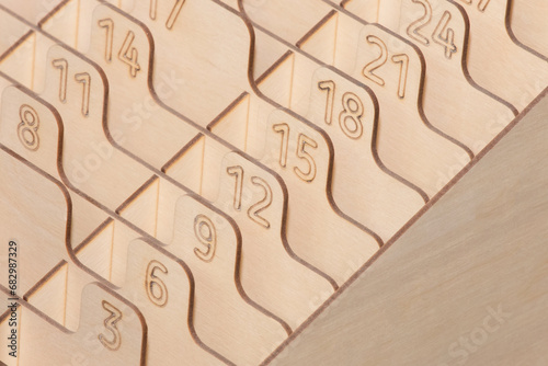 Numbered Sections Figures Storage Objects Parts Made OSB Material Signs Symbols Close-up Detail photo