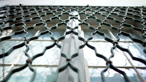 Canvastavla Metal window fence protection patterns demarcating property separation in buildi
