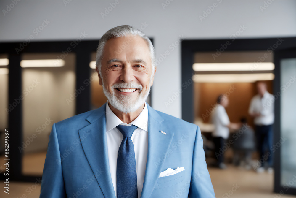Smiling old Indian man wearing suit in a modern business IT office Smiling old Indian man wearing suit in a modern business IT office