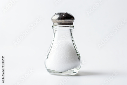 Salt shaker on white background