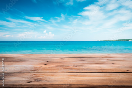 A wooden table set against the backdrop of the sea, an island, and the blue sky.Empty space for text. Bright image.
