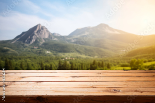 Empty wooden table with a blurred mountain hill background, suitable for montage or displaying your products. 