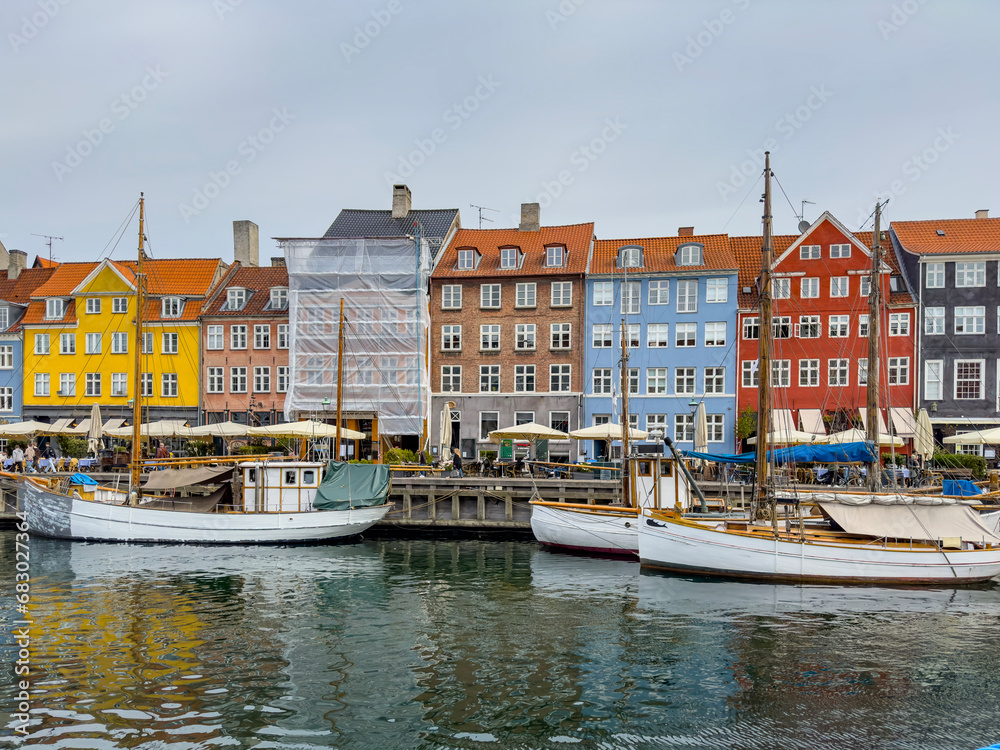Walking along Nyhamn's canals in Copenhagen, with old colorful buildings, Denmark